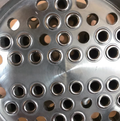 Perfect orbital fillet weld on a stainless steel tubesheet bundle, validated by 100% X-ray inspection.